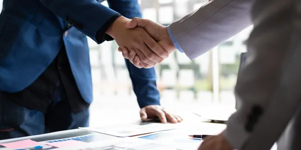 Commercial lease negotiation handshake for tenant representation